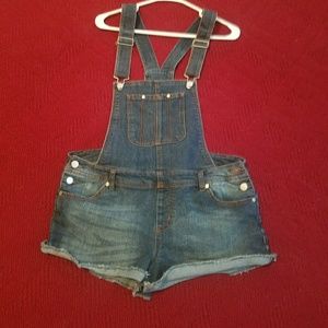 Distressed Denim Bib Overall shorts.